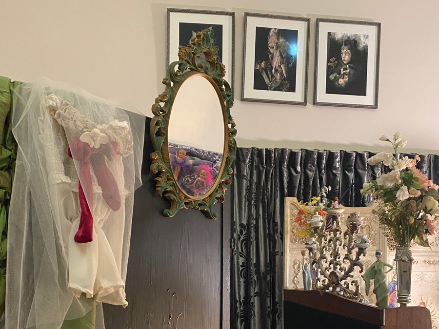 The Lair, Costume and Photography studio, mirror, artworks to silver curtains